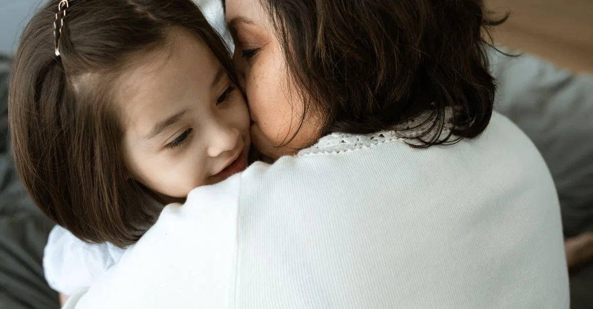 A parent and child sharing a hug